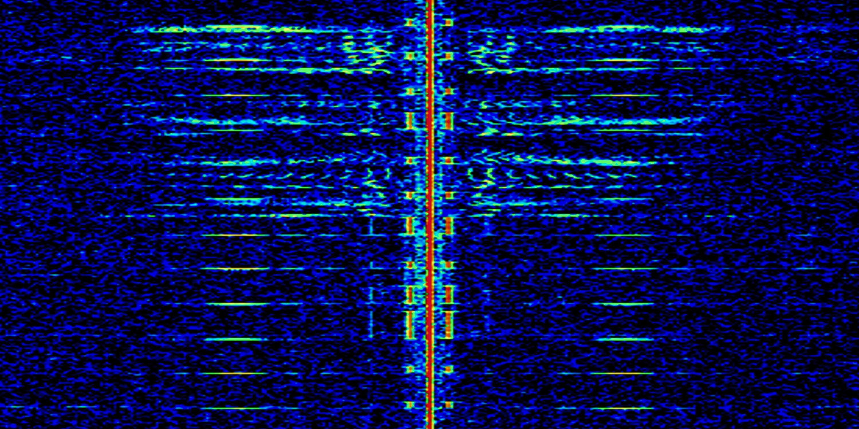 Radio spectrum visualization displaying a visible signal against a blue background.